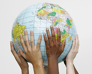 Hands of different persons carrying a globe